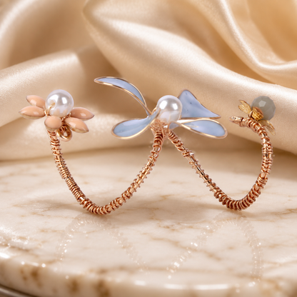 Cascadelle floral ring with rose gold petals and pearl detail, Opulent Echoes handcrafted
